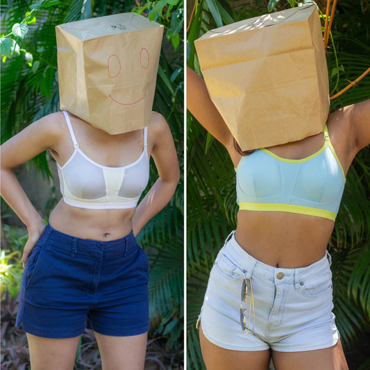 Two images of a person wearing a brown paper bag over their head with a smiley face, one in a white bra and blue shorts, the other in a light blue sports bra and white shorts, against a green leafy background.